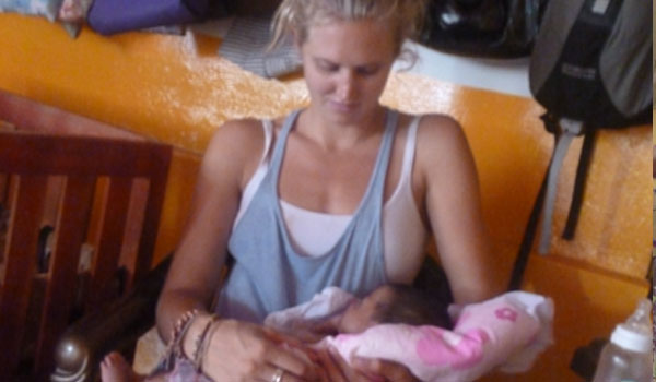 volunteer taking care of small kid in srilanka orphanage