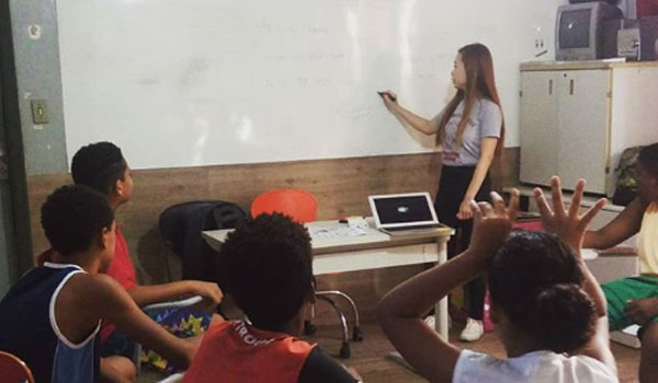 volunteer teaching basic course of computer to school kids
