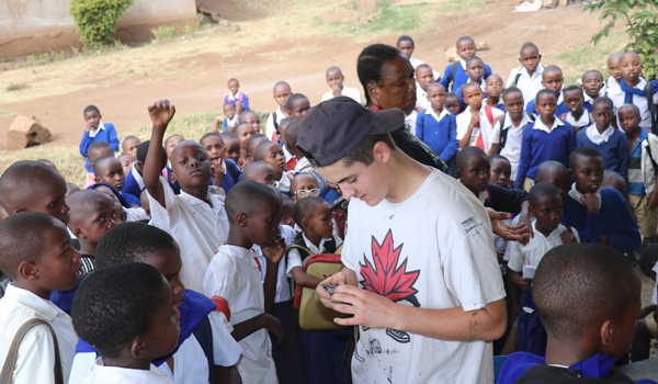 volunteer taking student picture