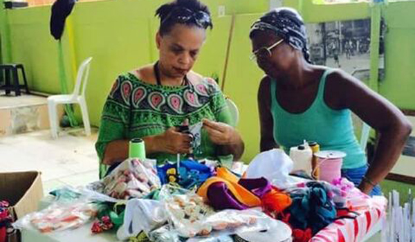 women making handicraft products