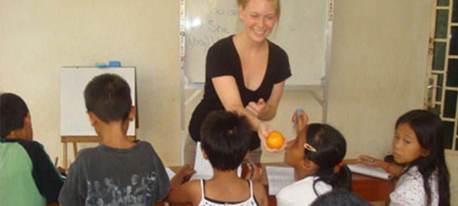 volunteers teaching children