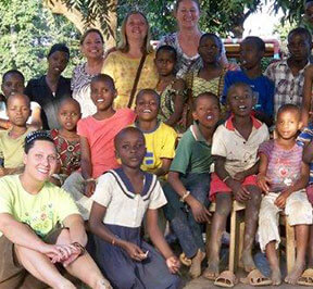 Volunteers with african orphans