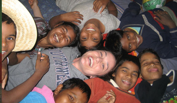 Kids having fuin time with volunteer in india
