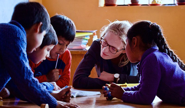 volunteer assisting child in study