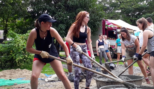 volunteer preparing raw material for construction