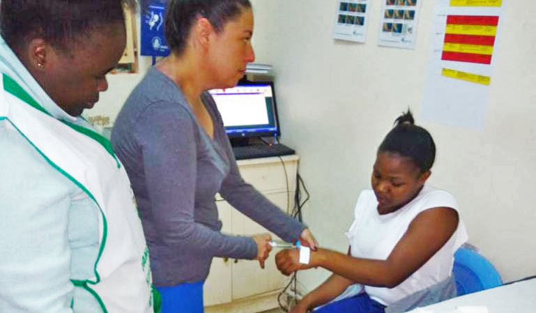 doctor injecting patient