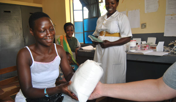 volunteer offering mediciine to patient