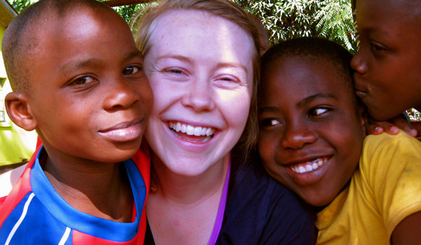 volunteer with orphan child